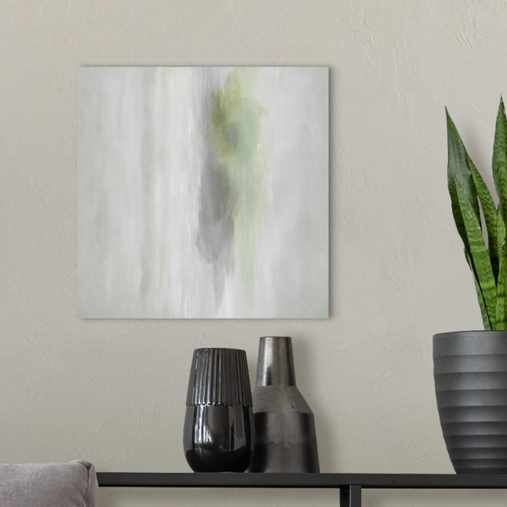 A modern room featuring Abstract artwork of pools of green colors permeating over a distressed gray background.