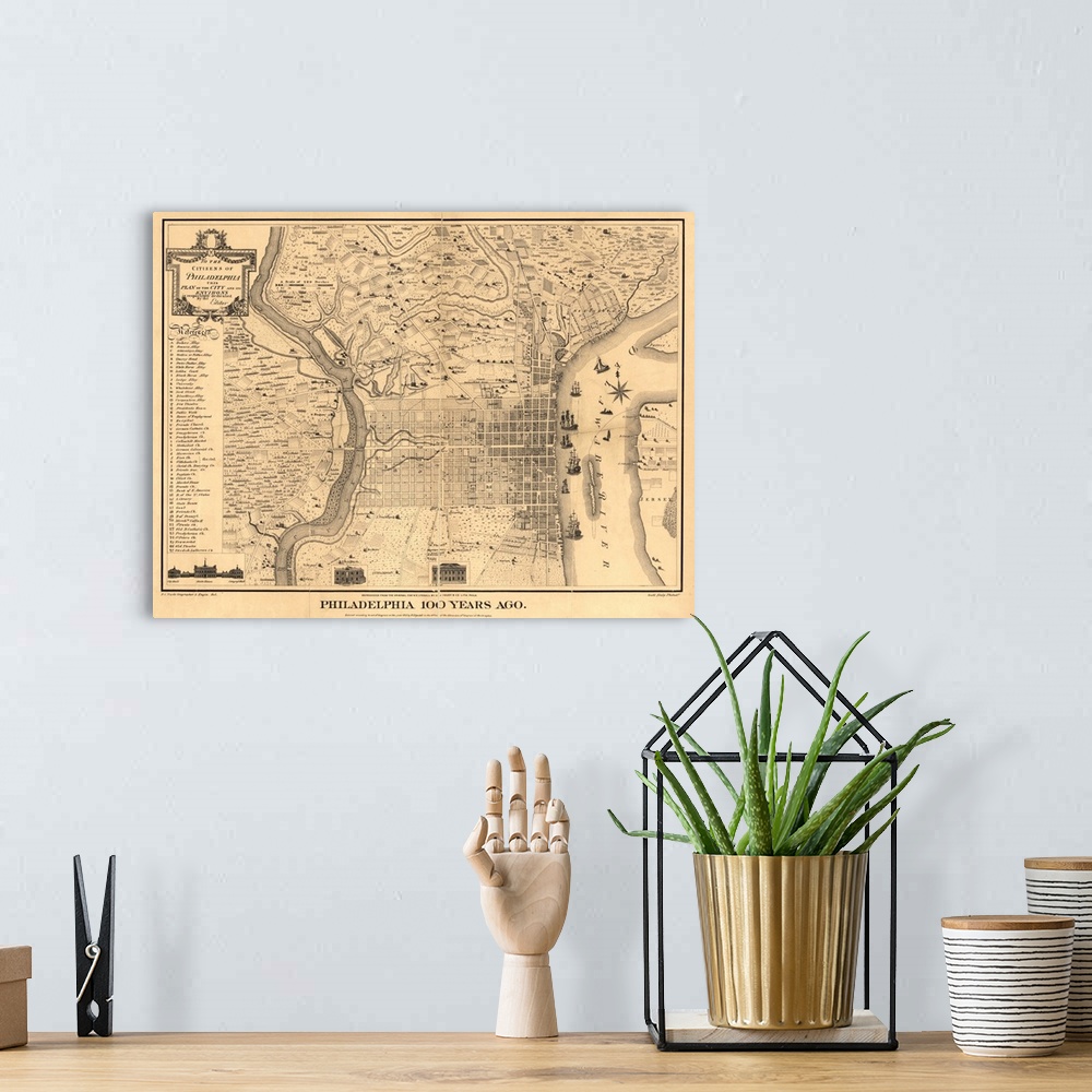 A bohemian room featuring Antique illustrated map of Philadelphia with a crease down the middle from the year 1875.