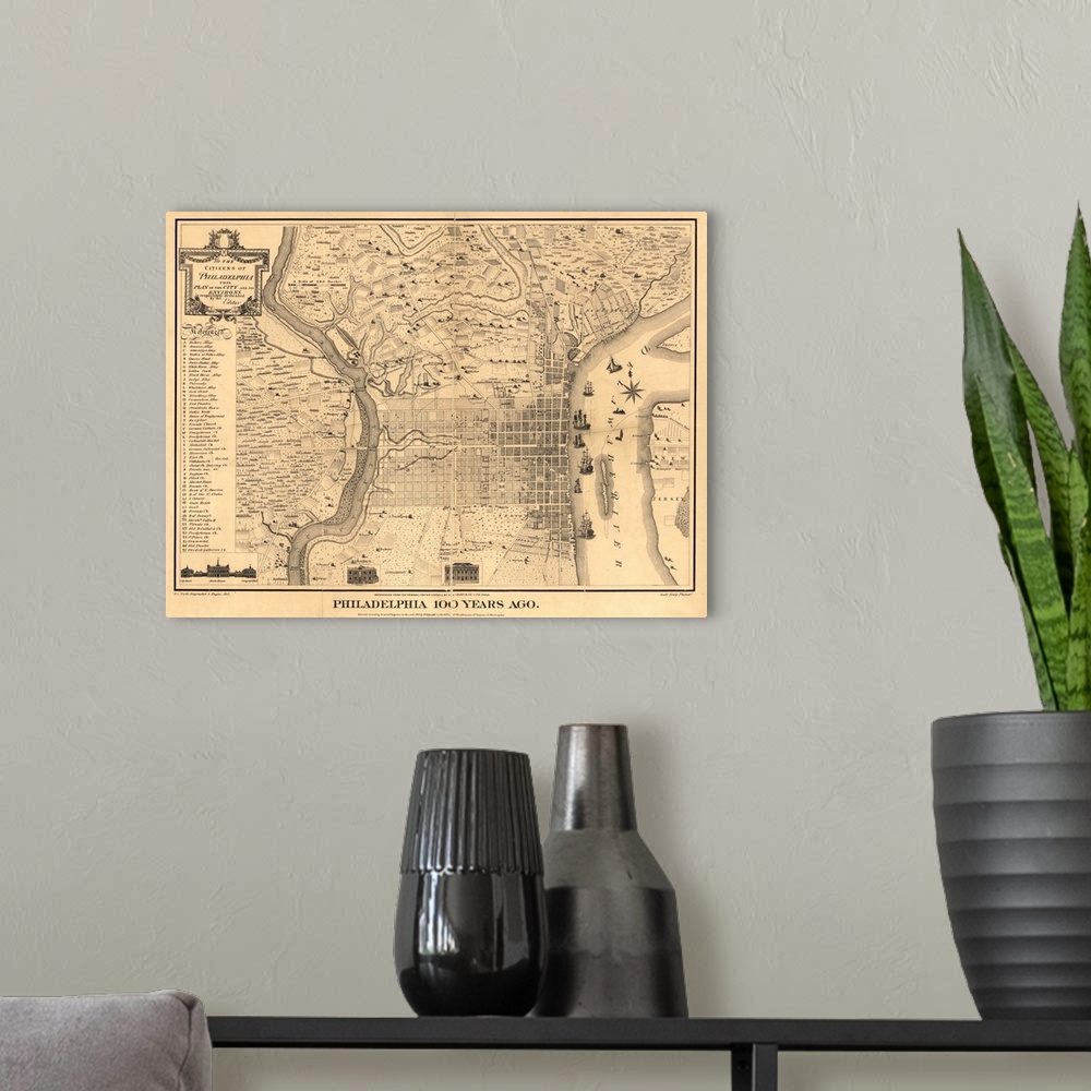 A modern room featuring Antique illustrated map of Philadelphia with a crease down the middle from the year 1875.