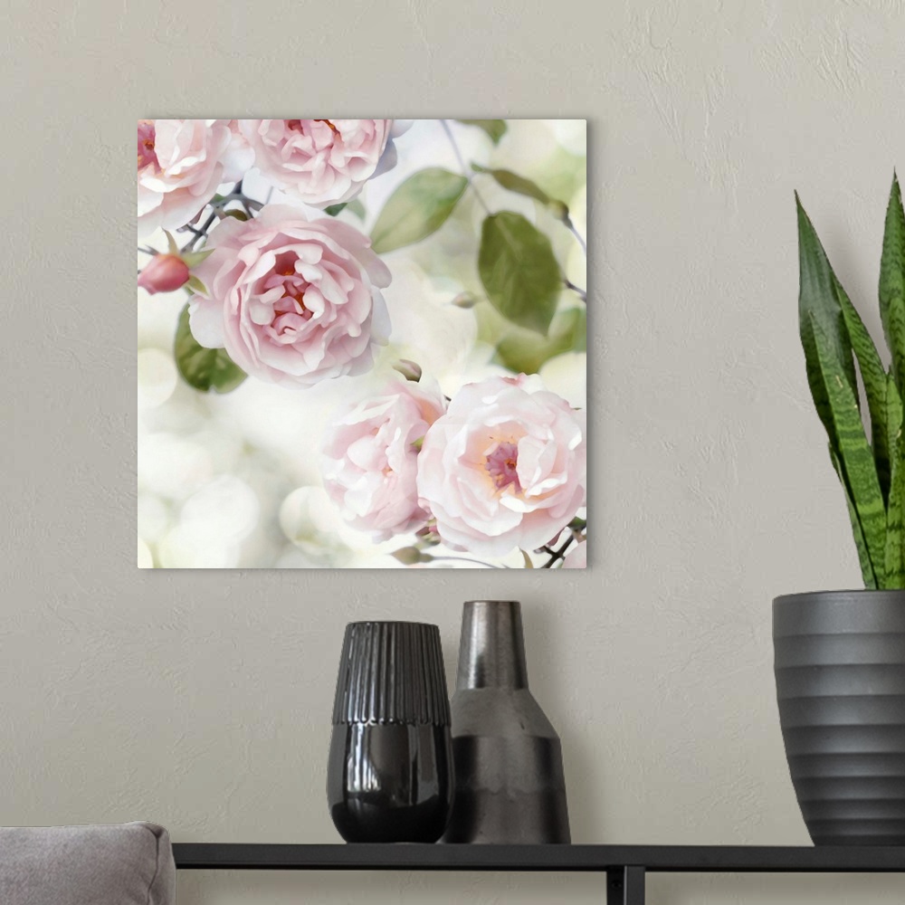 A modern room featuring Decorative artwork featuring soft flowers in shades of pink over a bokeh background.