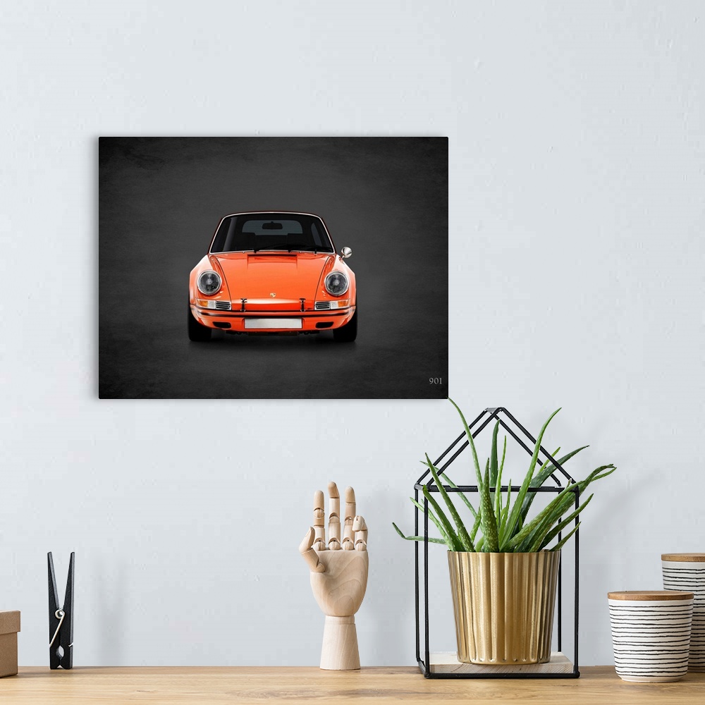 A bohemian room featuring Photograph of an orange Porsche 901 printed on a black background with a dark vignette.