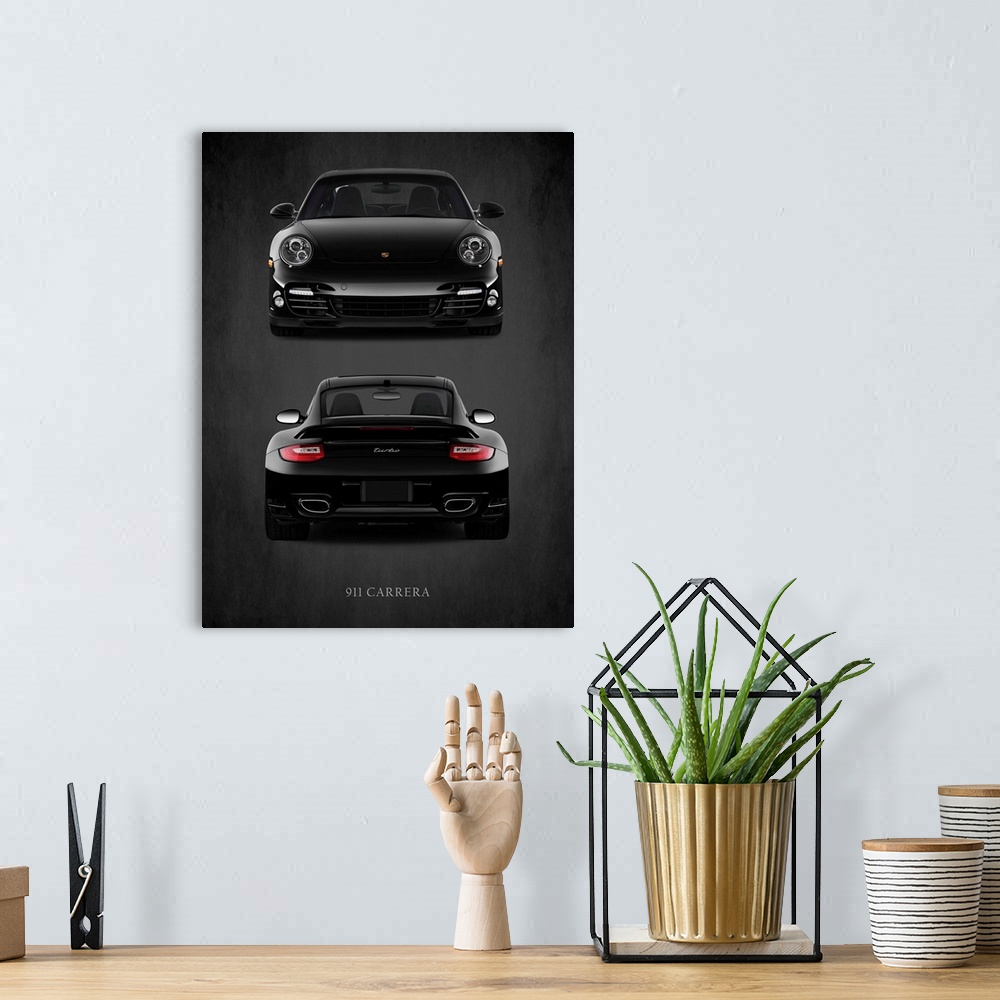 A bohemian room featuring Photograph of the front and back view of a black Porsche 911 Carrera Turbo printed on a black bac...