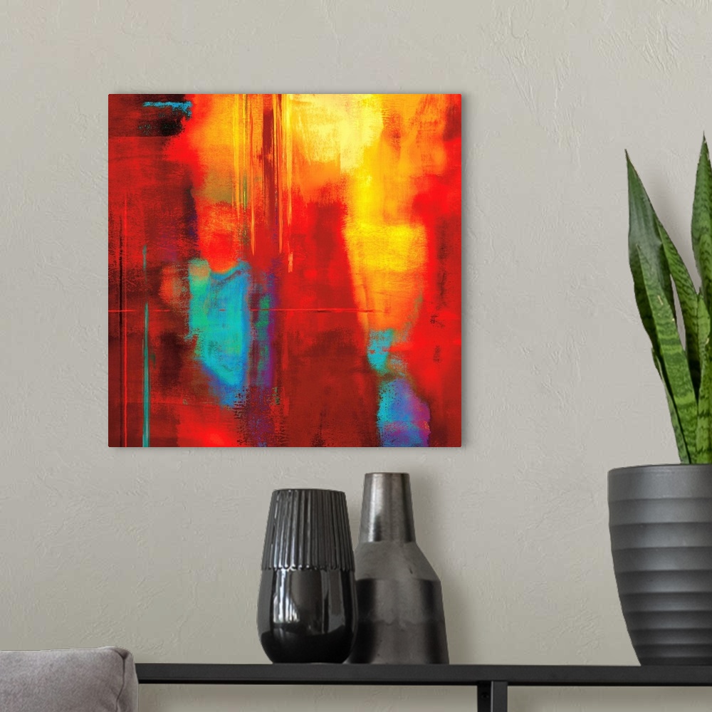 A modern room featuring Bright red square abstract art with cool hints of blue, green, and purple.