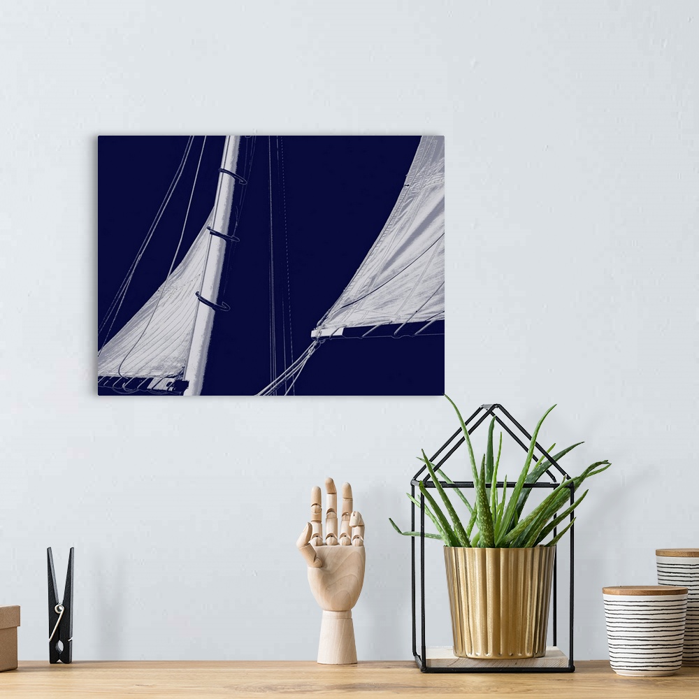 A bohemian room featuring Indigo and white illustration of sails from a sailboat.
