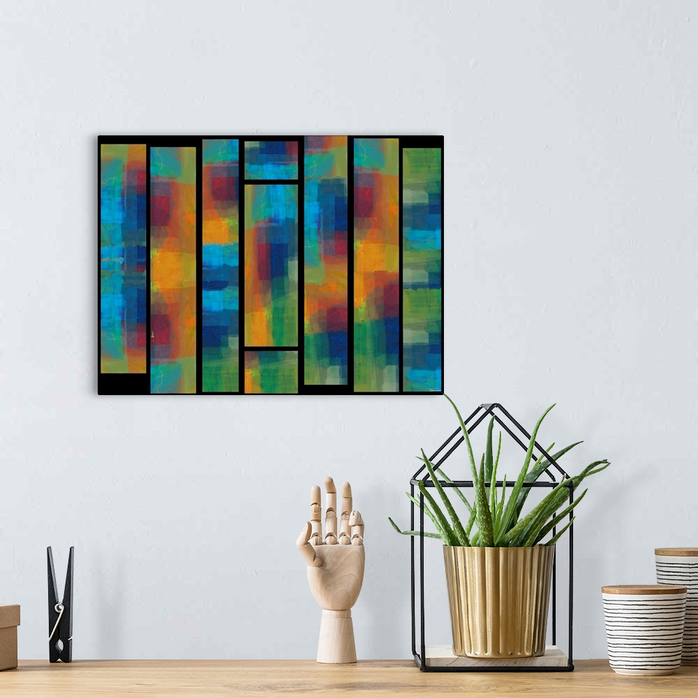 A bohemian room featuring Abstract artwork with colorful stained glass window like designs on a black background.