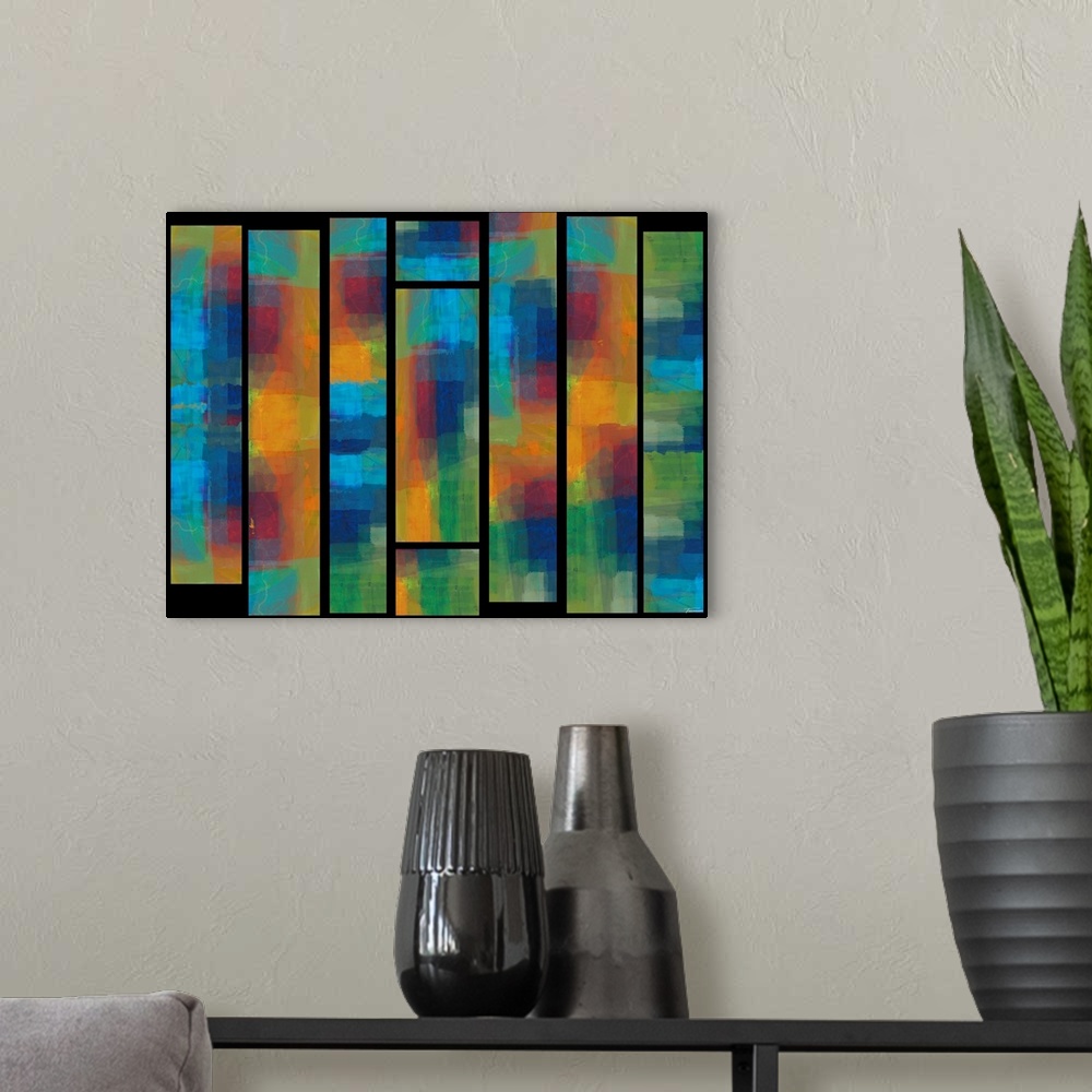 A modern room featuring Abstract artwork with colorful stained glass window like designs on a black background.