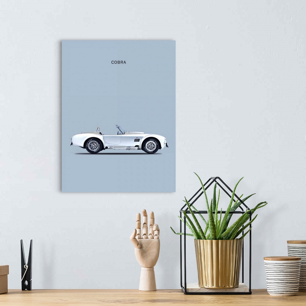 A bohemian room featuring Photograph of a silver Shelby Cobra 65 printed on a silver background