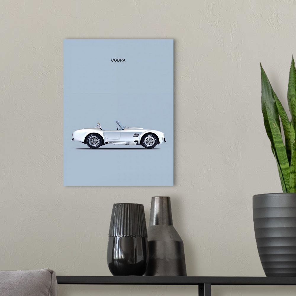 A modern room featuring Photograph of a silver Shelby Cobra 65 printed on a silver background