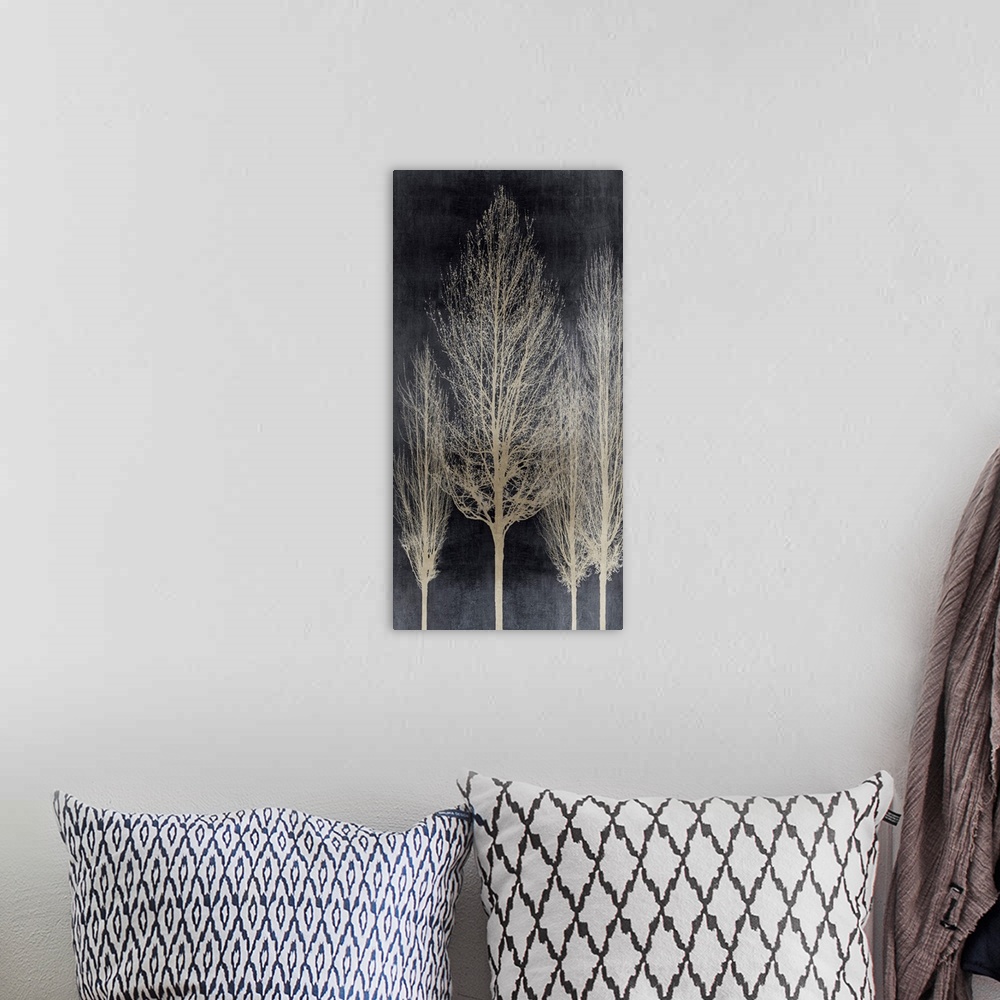 A bohemian room featuring Decorative artwork featuring an aged silver silhouette of leafless trees over a distressed backgr...