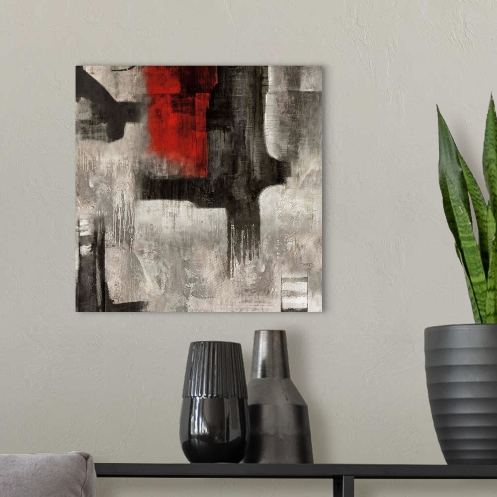 A modern room featuring Square abstract painting with bold black and red brushstrokes on top of a white and gray background.