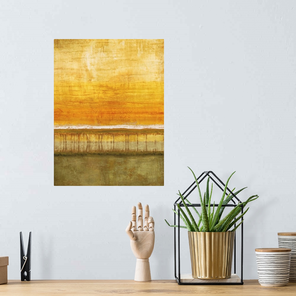 A bohemian room featuring Abstract painting with a white horizon line and a yellow and orange sky with olive green below.