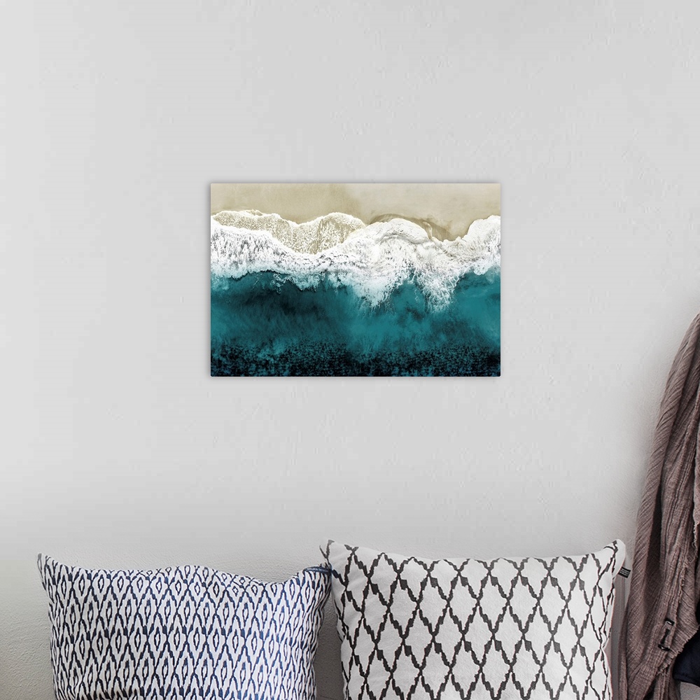 A bohemian room featuring One artwork in a series of aerial shots of a beach as teal waves break upon the shore.