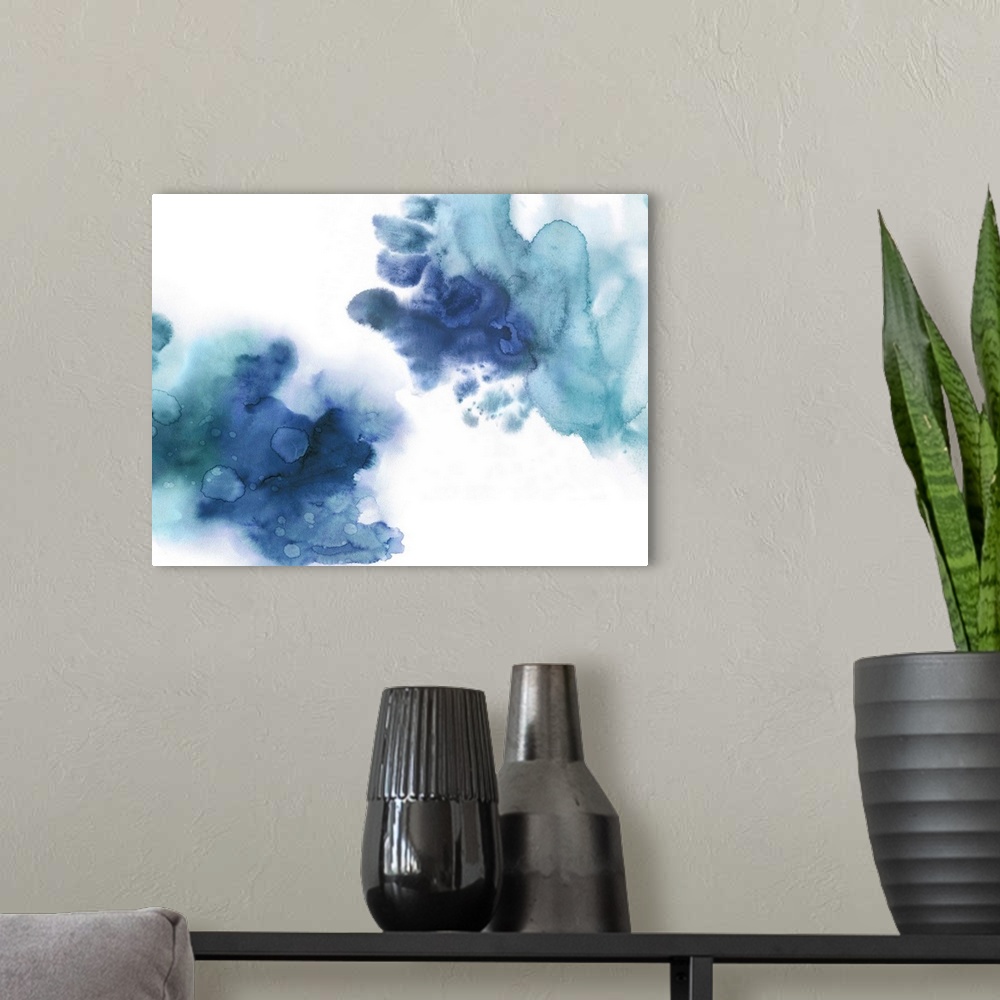 A modern room featuring Abstract painting with shades of blue splattered together on a white background.