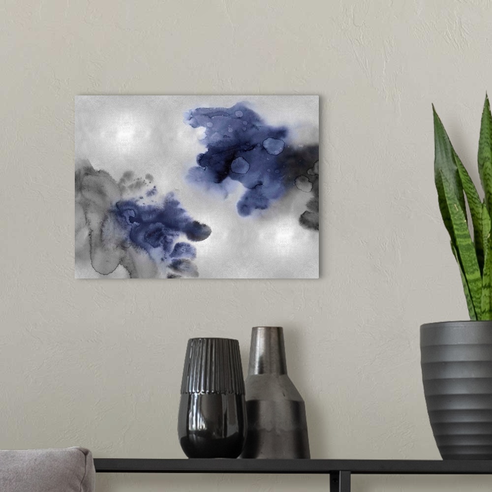 A modern room featuring Abstract painting with indigo and black hues splattered together on a silver background.