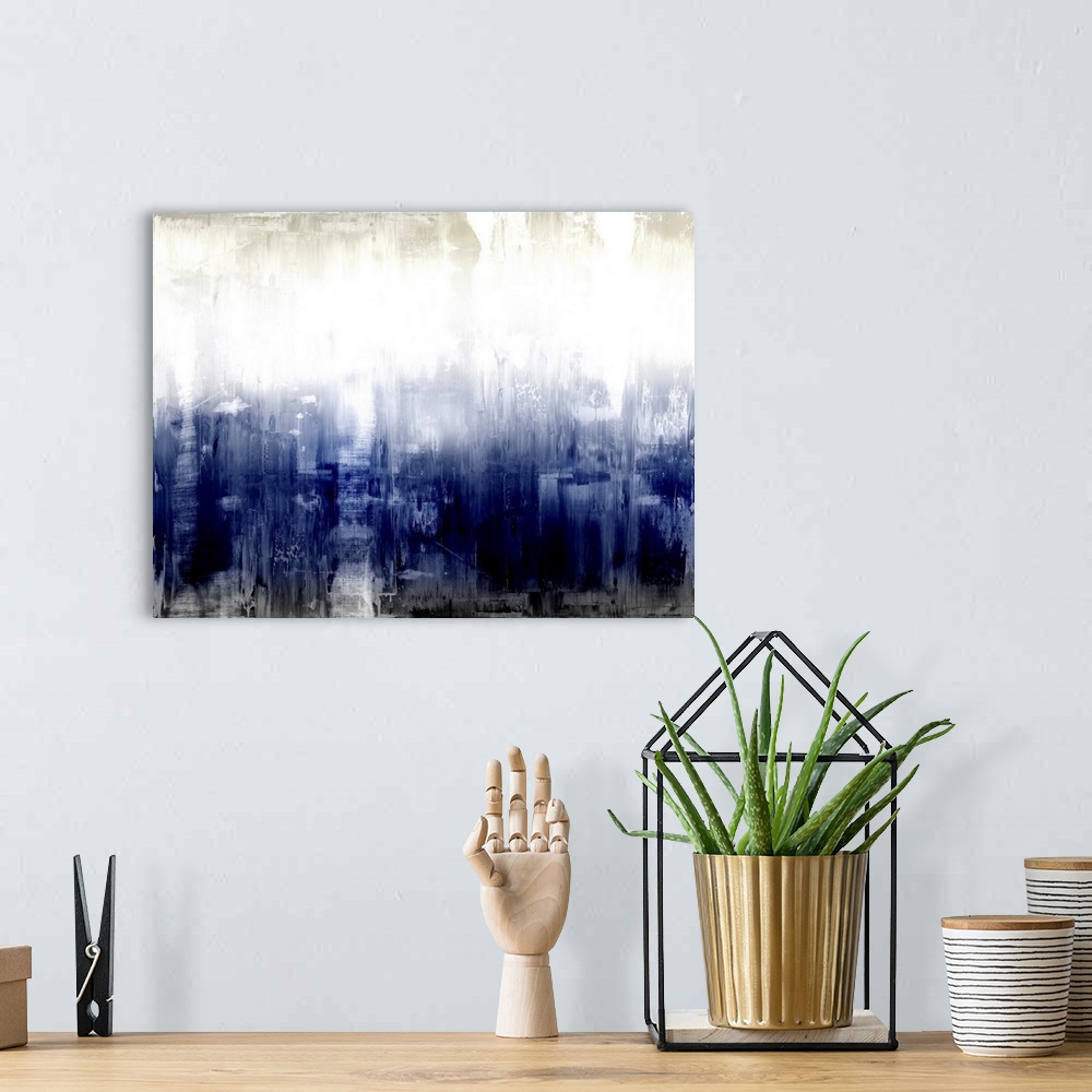A bohemian room featuring Large abstract painting with deep shades of blue and black at the bottom and lighter hues of gray...