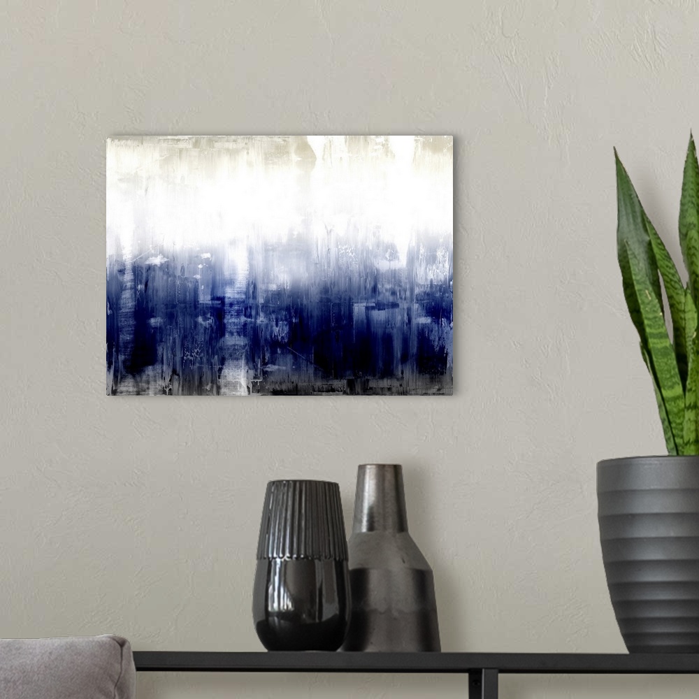A modern room featuring Large abstract painting with deep shades of blue and black at the bottom and lighter hues of gray...