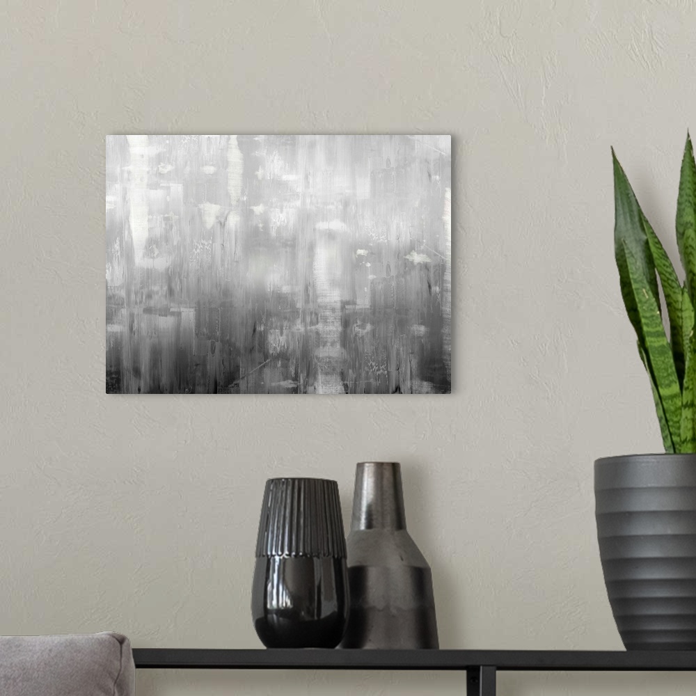 A modern room featuring Large abstract painting with shades of gray streaking down the canvas.