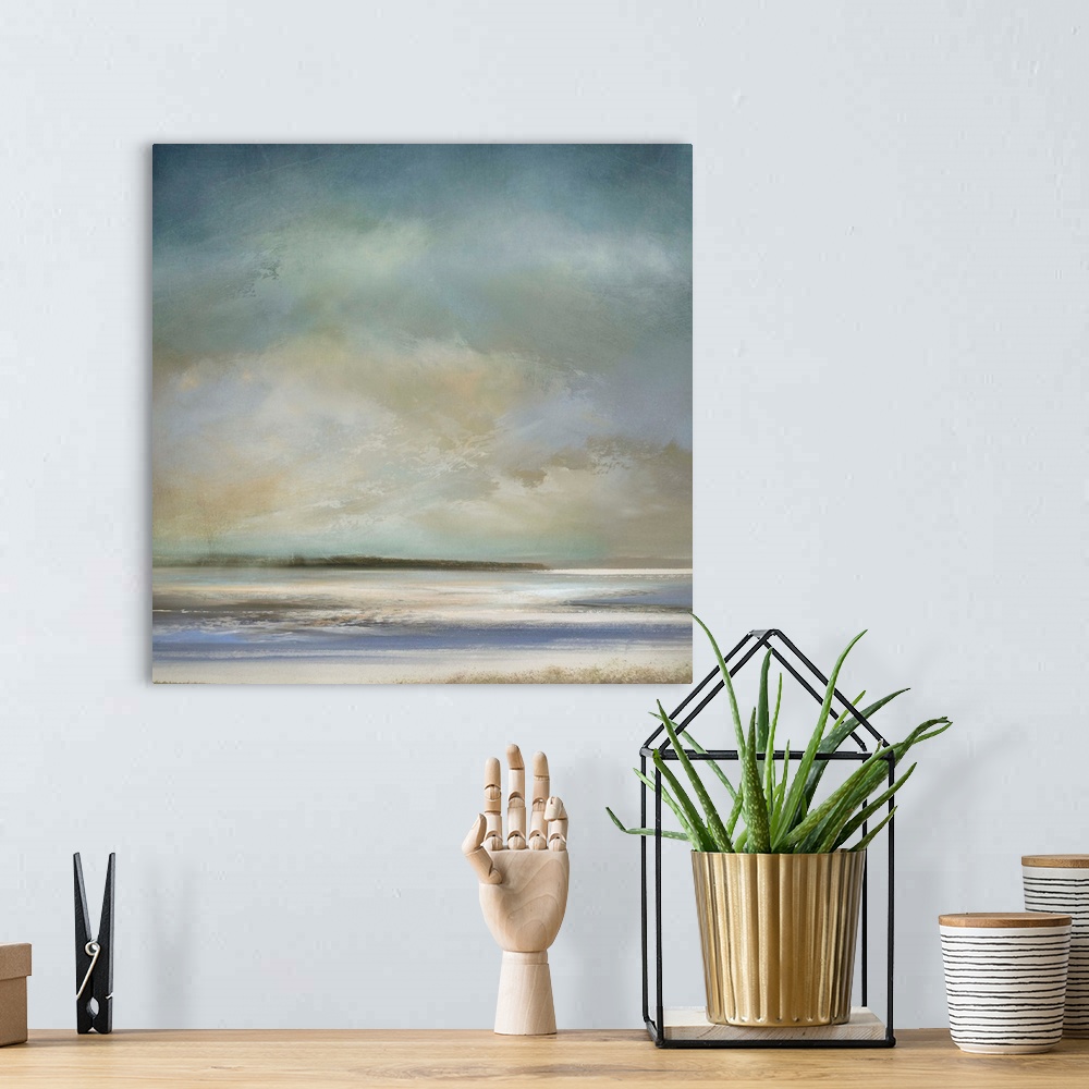 A bohemian room featuring Abstract landscape artwork in subdued colors of a beach shore in the morning.