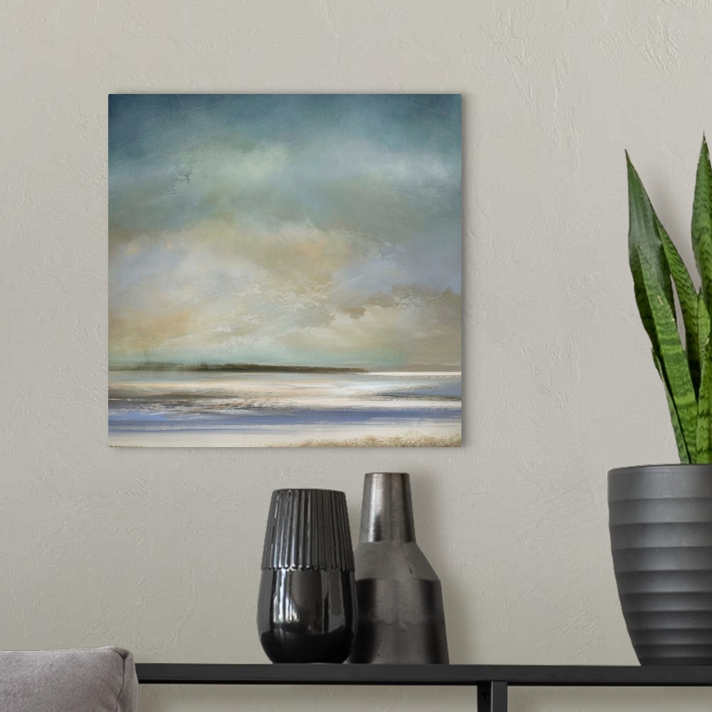 A modern room featuring Abstract landscape artwork in subdued colors of a beach shore in the morning.
