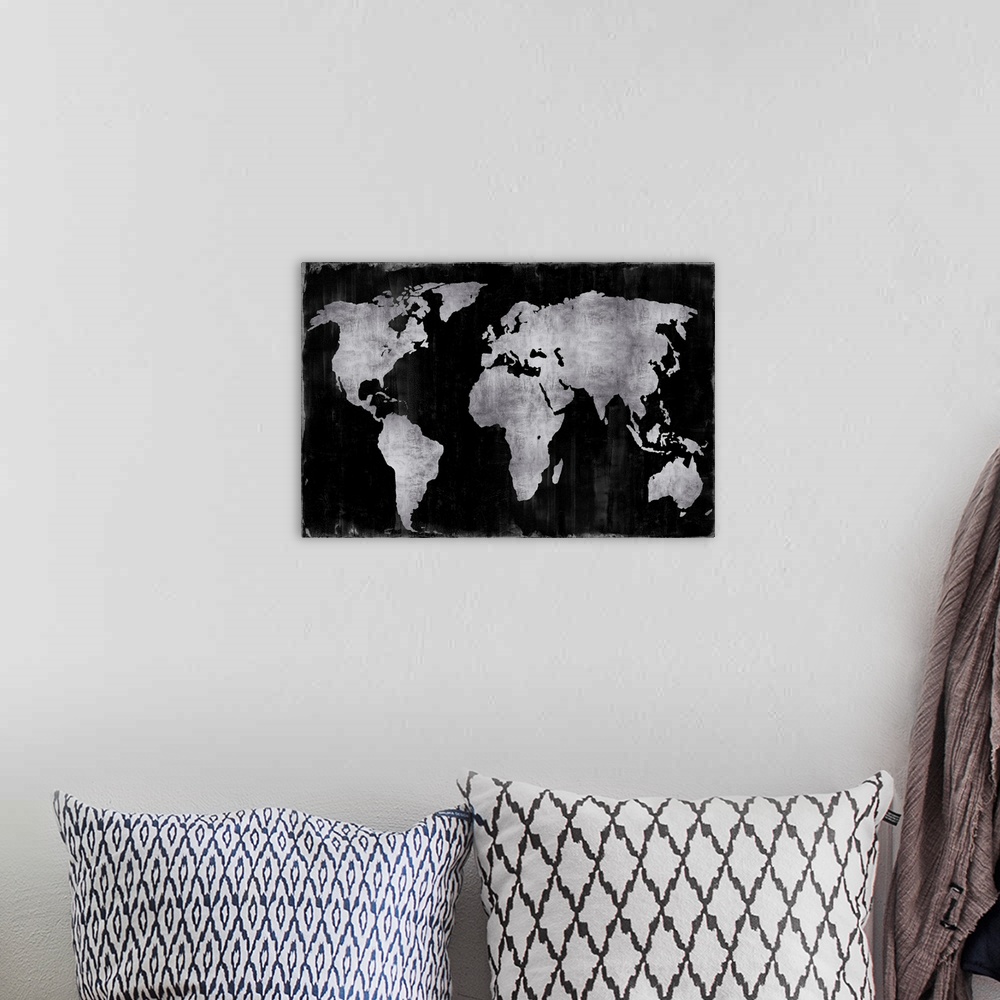 A bohemian room featuring World map in silver and black.