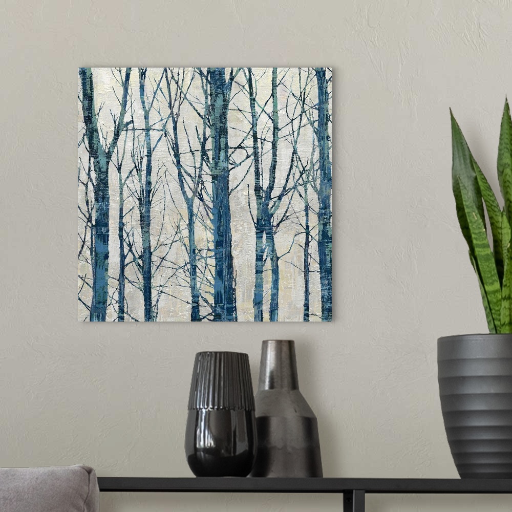A modern room featuring Square decor with large thin trees in shades of blue on a neutral colored background.