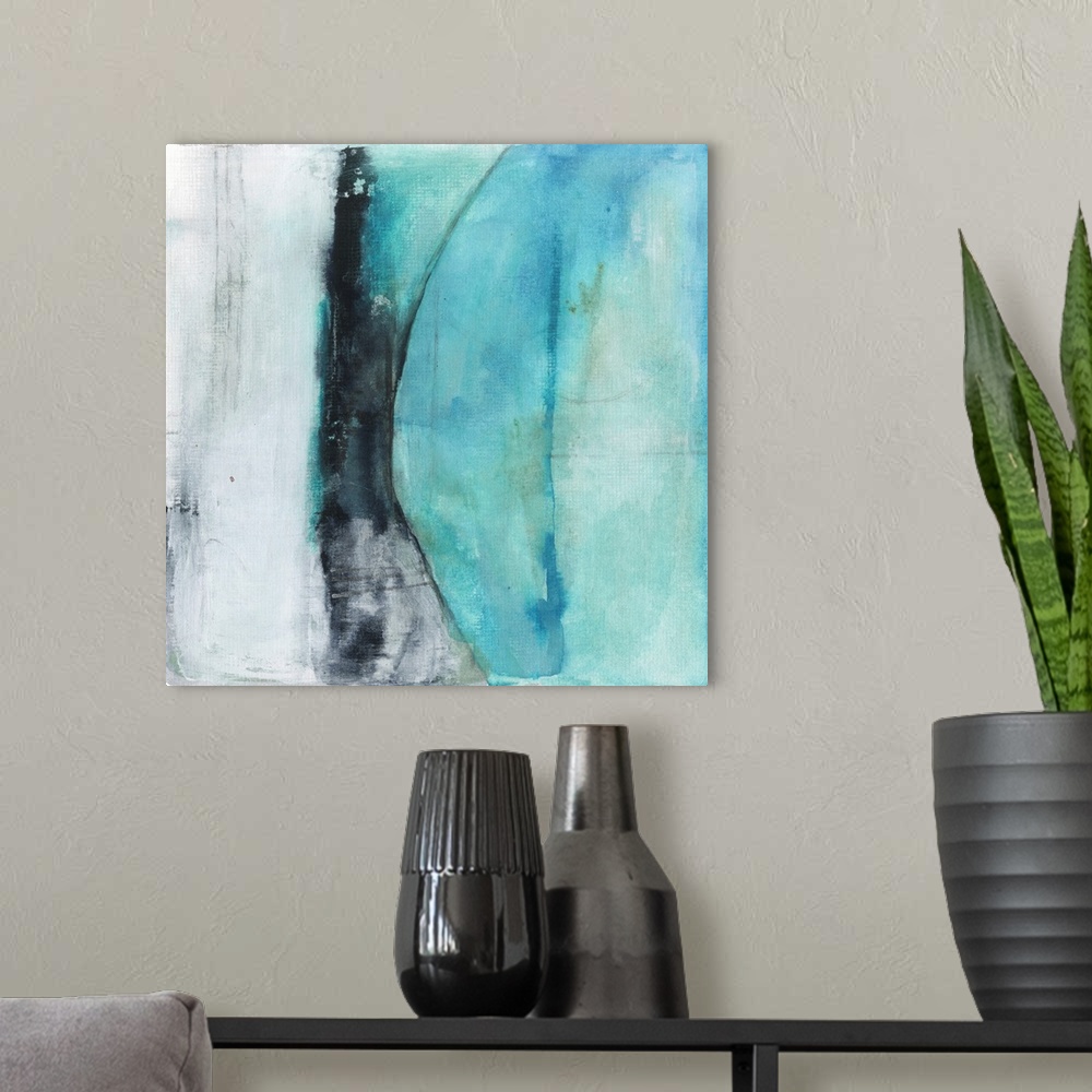 A modern room featuring Square abstract painting created with shades of blue and black with a section of white-gray on th...