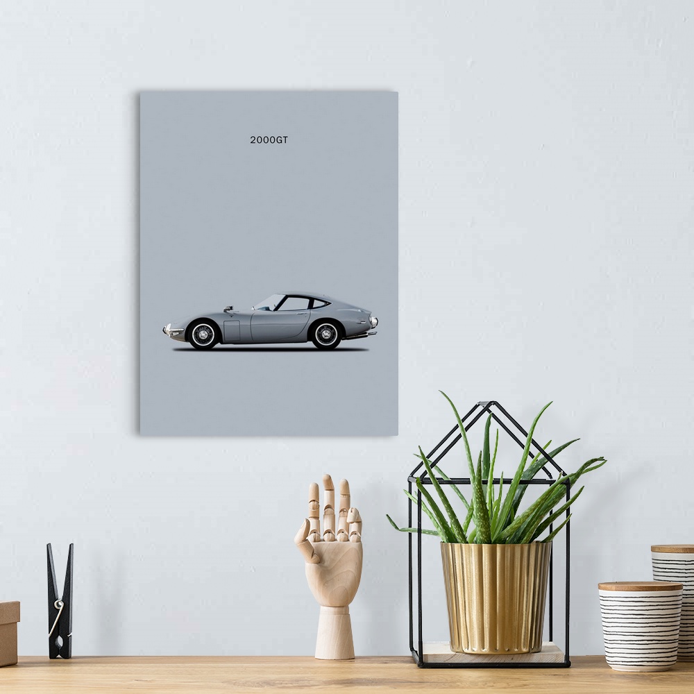 A bohemian room featuring Photograph of a silver Toyota 2000GT printed on a gray background