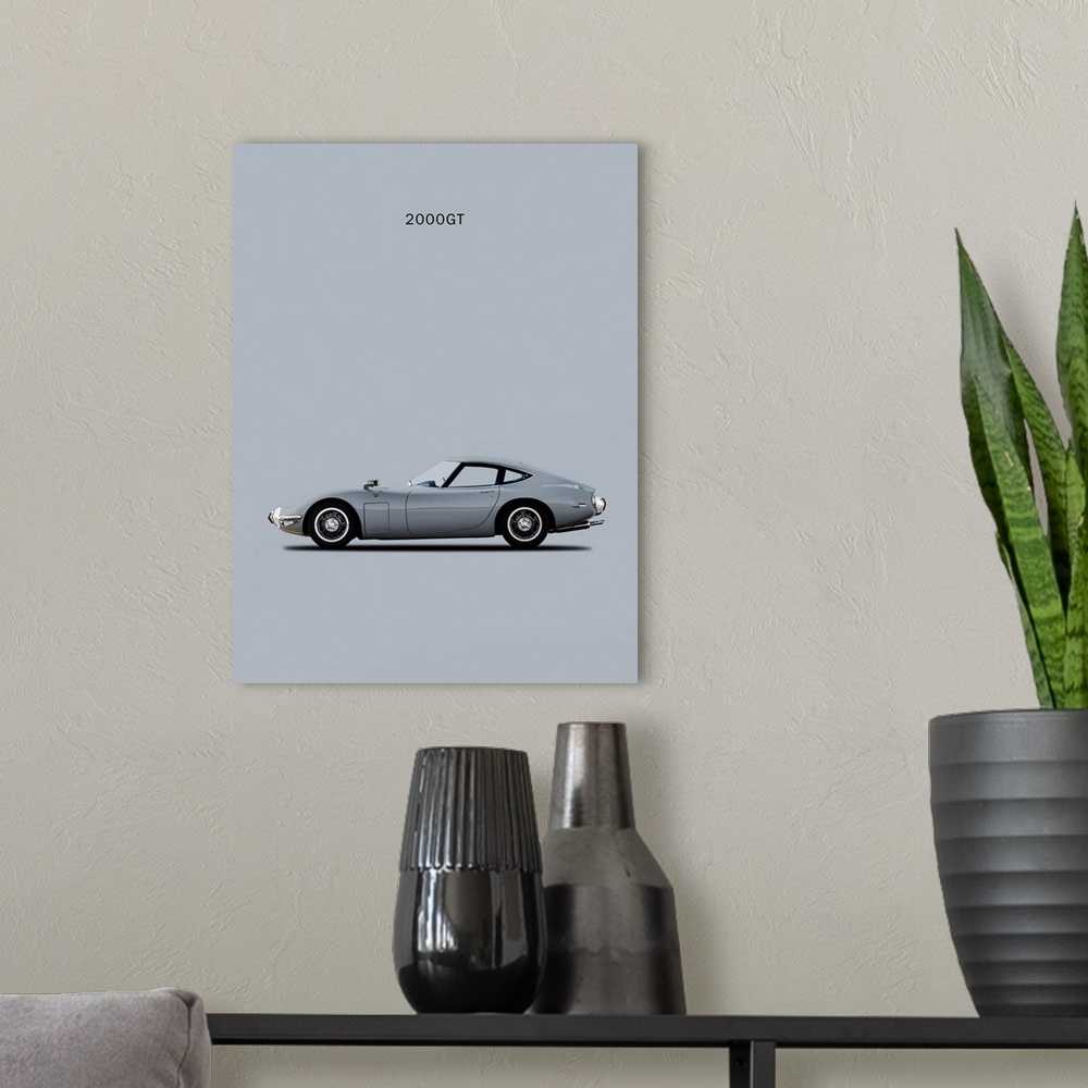 A modern room featuring Photograph of a silver Toyota 2000GT printed on a gray background