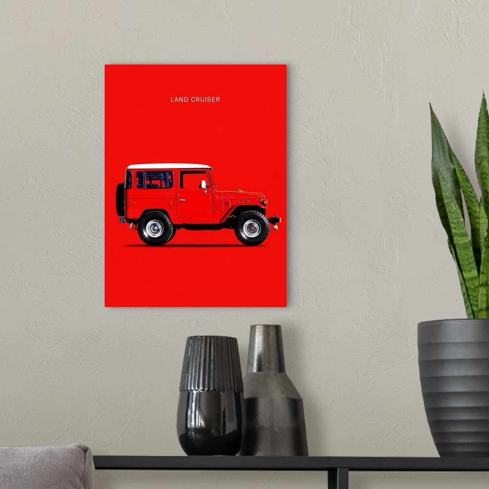 A modern room featuring Photograph of a red Toyota Land Cruiser FJ40 1977 with a white hood printed on a red background