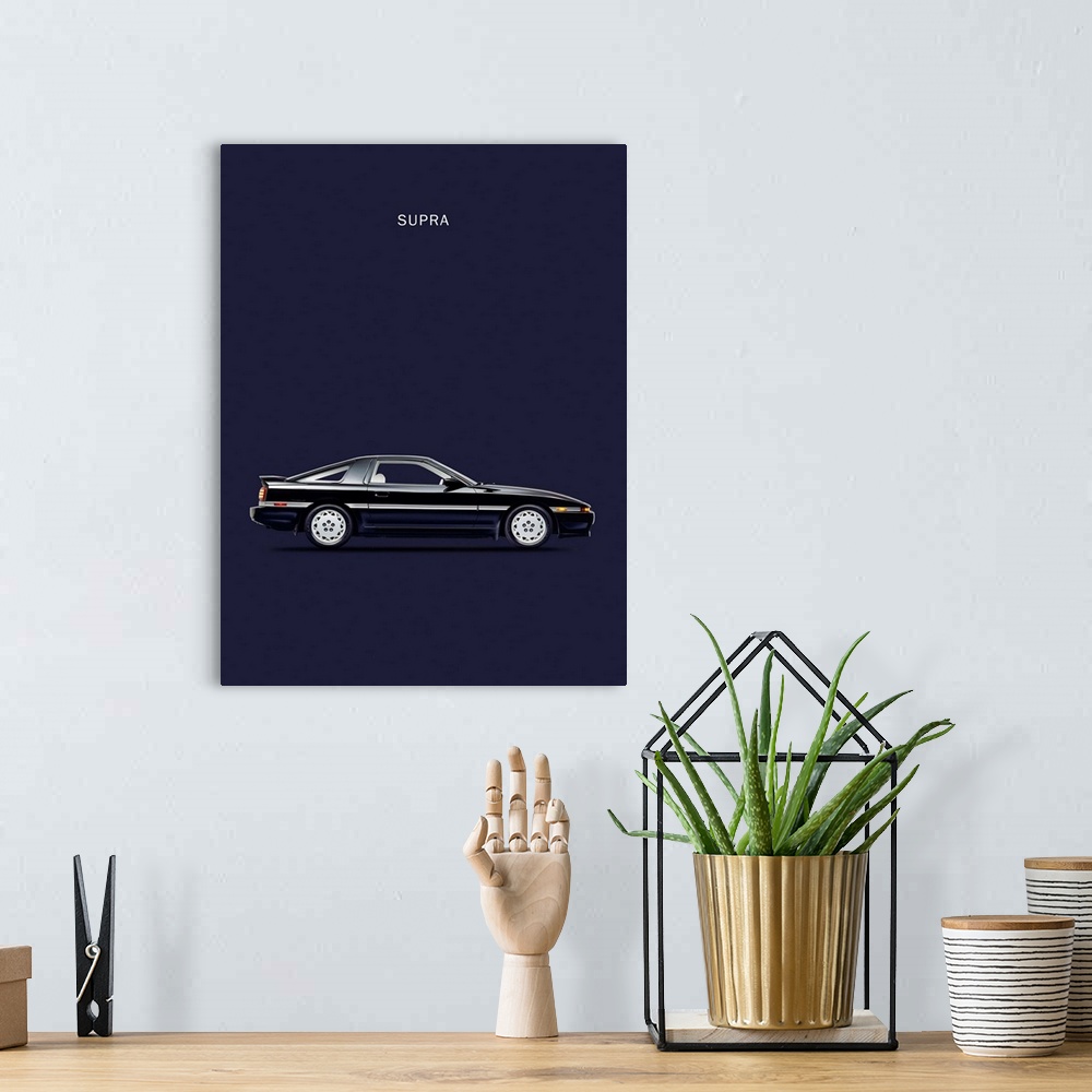 A bohemian room featuring Photograph of a black Toyota Supra Turbo printed on a navy blue background