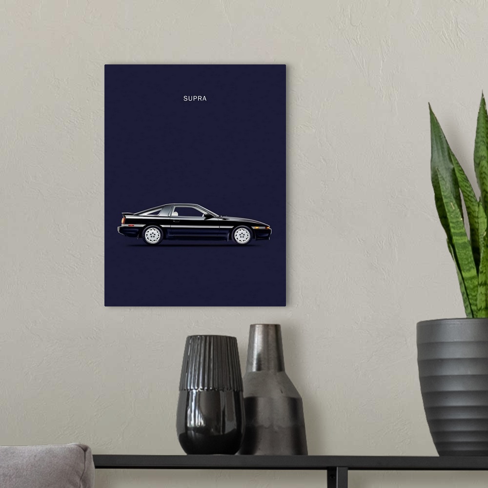 A modern room featuring Photograph of a black Toyota Supra Turbo printed on a navy blue background