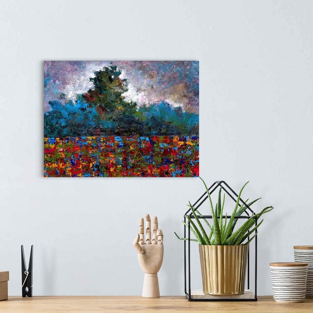 A bohemian room featuring Abstract landscape created with many colors and small, layered brushstrokes.