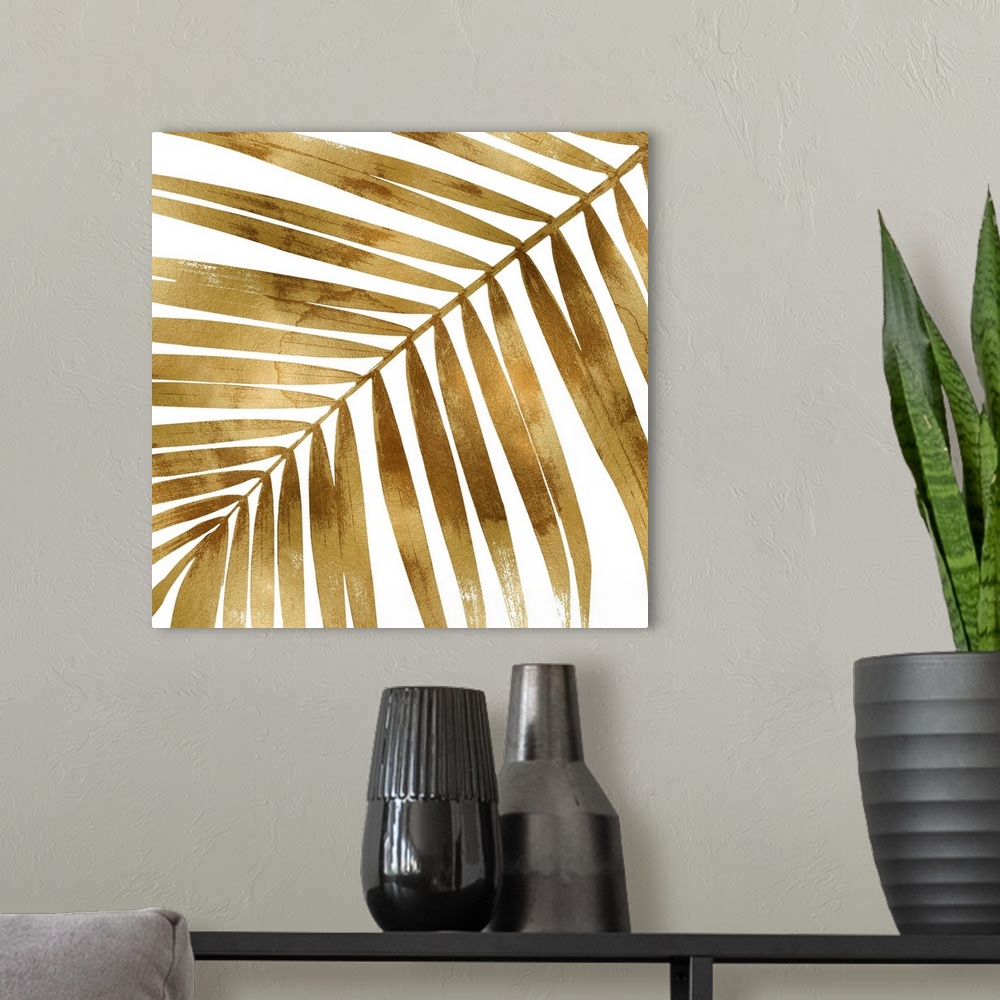 A modern room featuring Square decor with a metallic gold silhouette of a palm leaf on a solid white background.