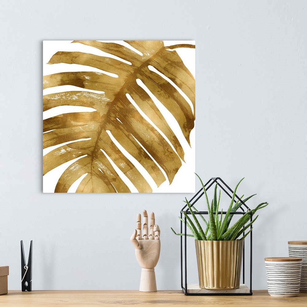 A bohemian room featuring Square decor with a metallic gold silhouette of a palm leaf on a solid white background.