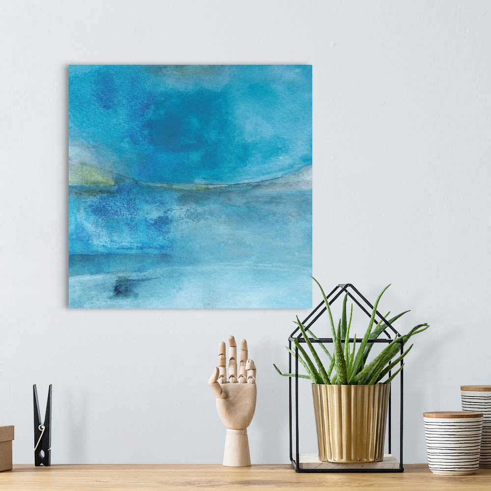 A bohemian room featuring Square abstract painting created with shades of blue coming together.