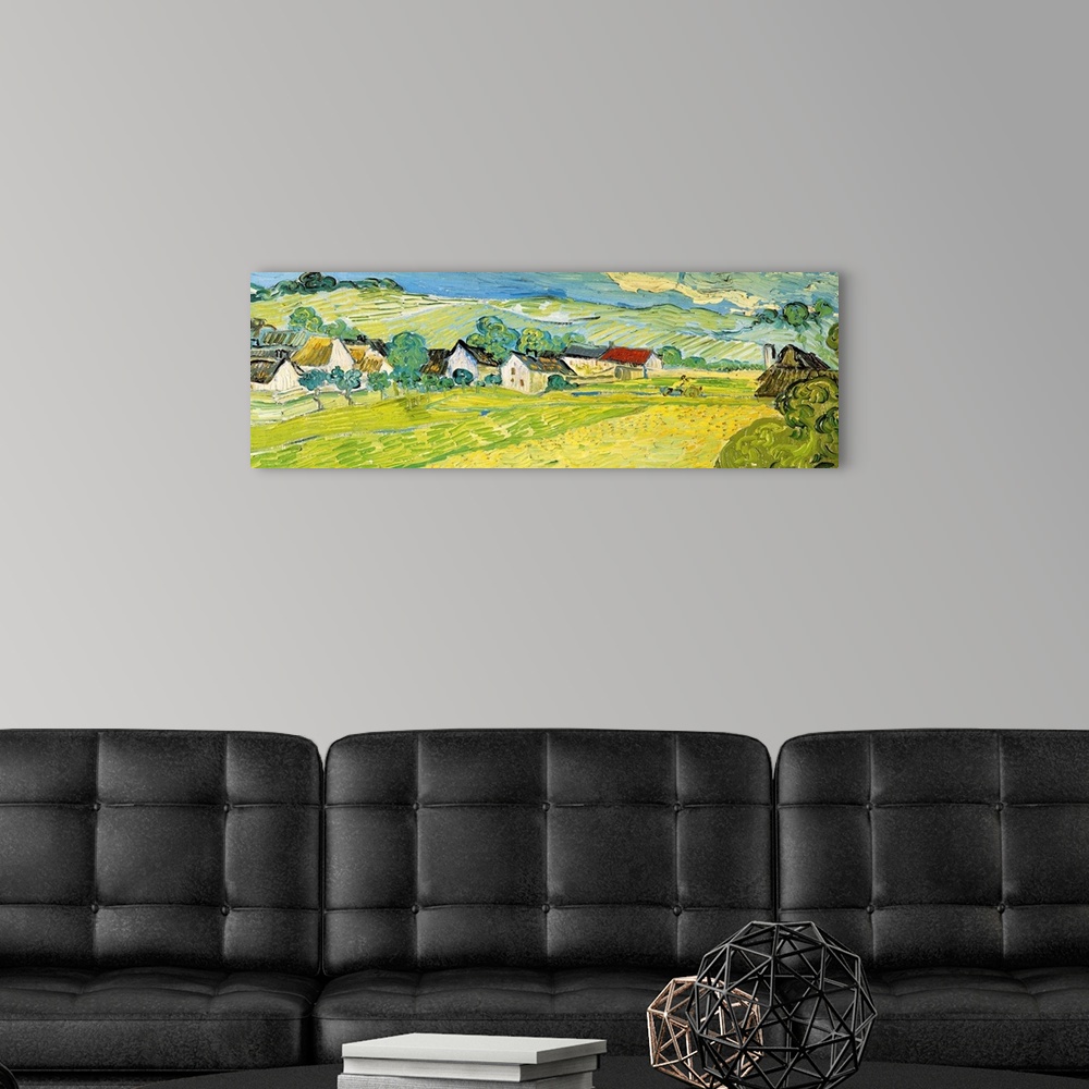 A modern room featuring Painting of a beautiful landscape of a village and fields by Vincent Van Gogh.