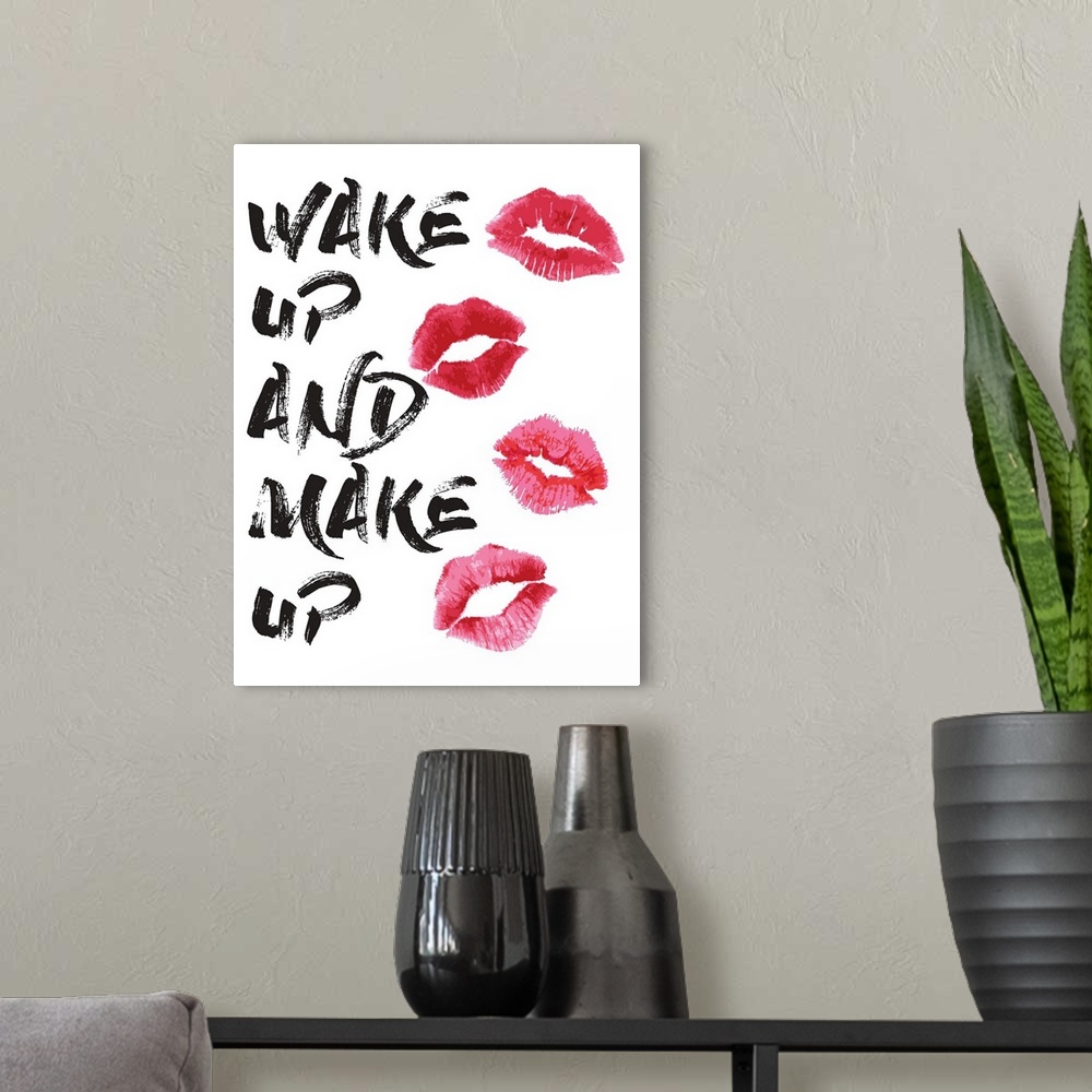 A modern room featuring Decorative artwork with the words: Wake up and make up.
