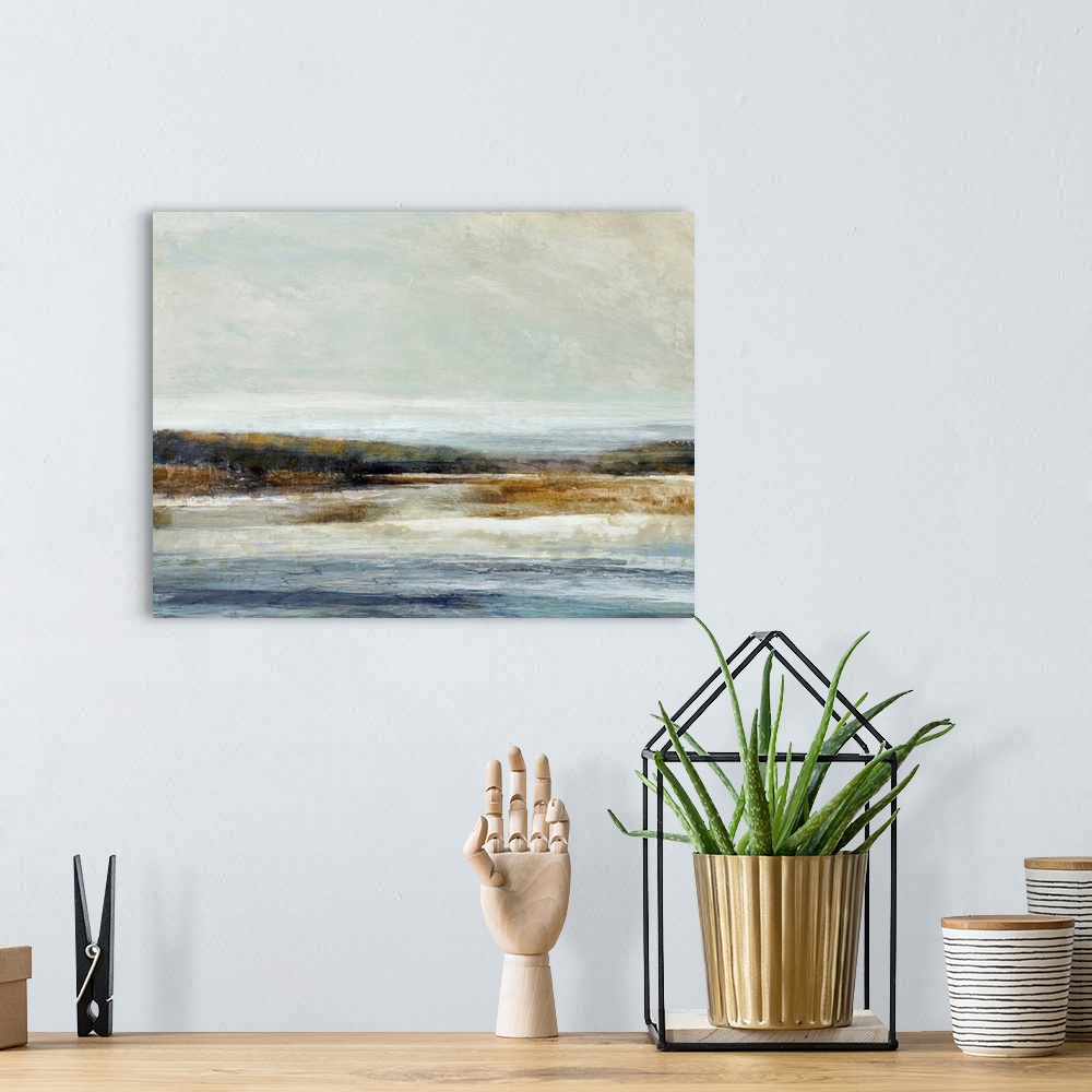 A bohemian room featuring Abstract landscape artwork of the edge where land meets water in subdued colors.
