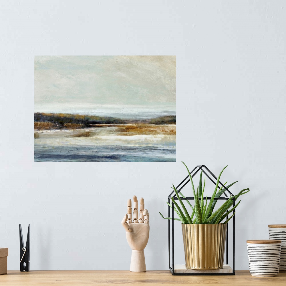 A bohemian room featuring Abstract landscape artwork of the edge where land meets water in subdued colors.