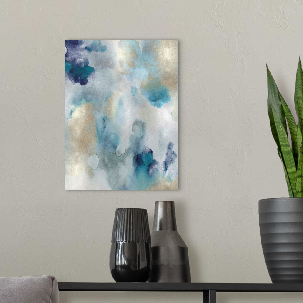 A modern room featuring Abstract painting with shades of blue and gold hues splattered together on a silver background.