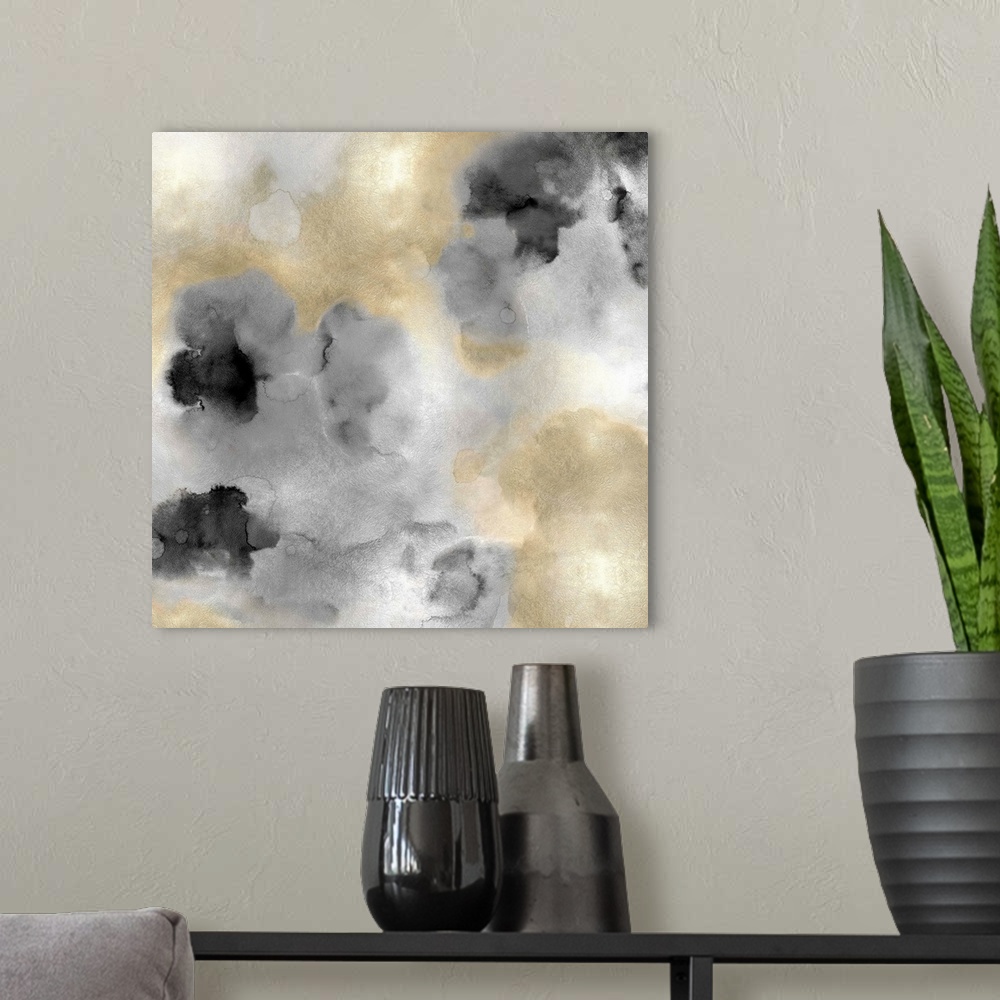 A modern room featuring Abstract painting with gold and black hues splattered together on a silver background.