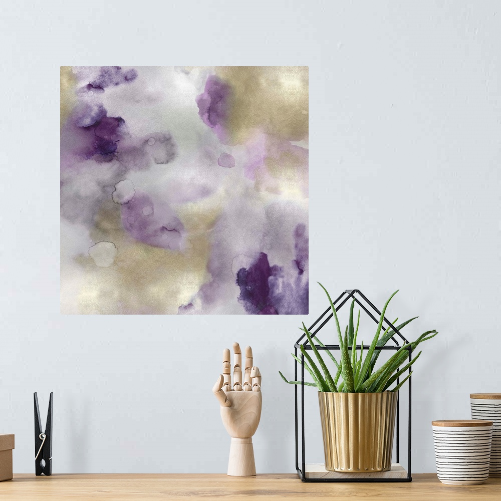A bohemian room featuring Abstract painting with purple and gold hues splattered together on a silver background.