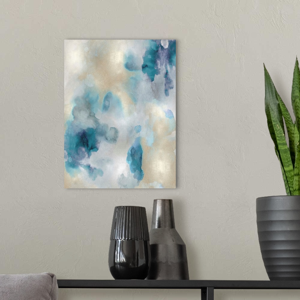 A modern room featuring Abstract painting with shades of blue and gold hues splattered together on a silver background.