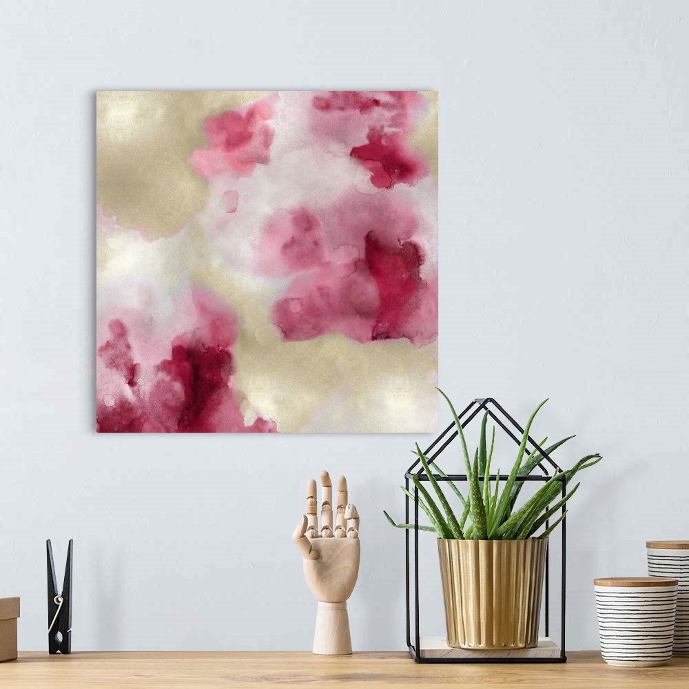 A bohemian room featuring Abstract painting with shades of pink and gold hues splattered together on a silver background.