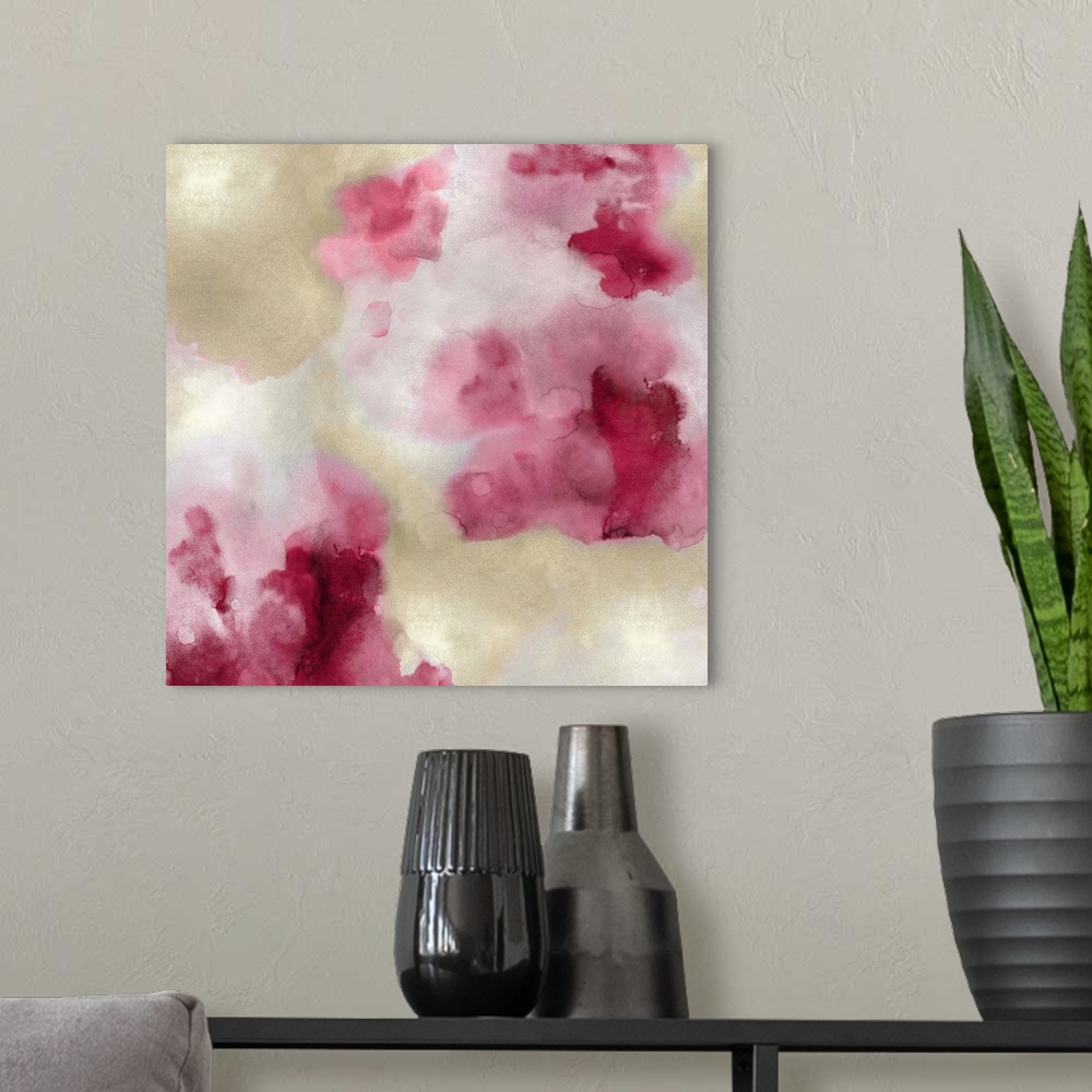 A modern room featuring Abstract painting with shades of pink and gold hues splattered together on a silver background.