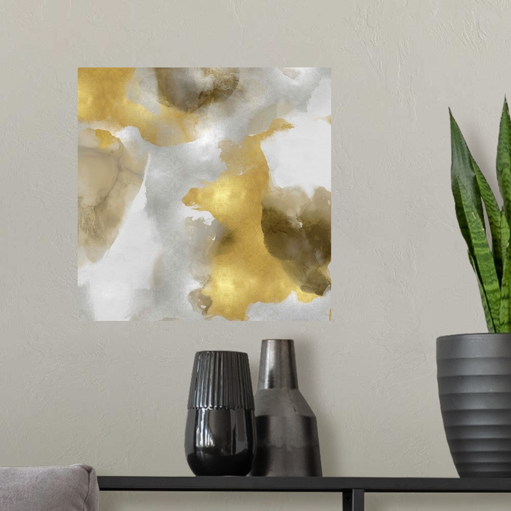 A modern room featuring Abstract painting with metallic gold and silvers splattered together on a gray background.
