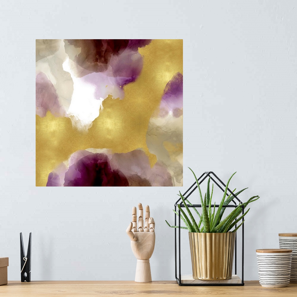 A bohemian room featuring Abstract painting with shades of purple, gray, and gold splattered together on a white background.