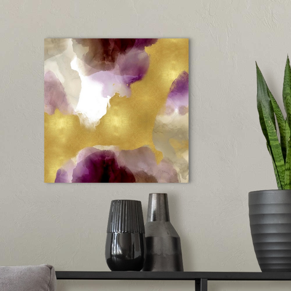 A modern room featuring Abstract painting with shades of purple, gray, and gold splattered together on a white background.