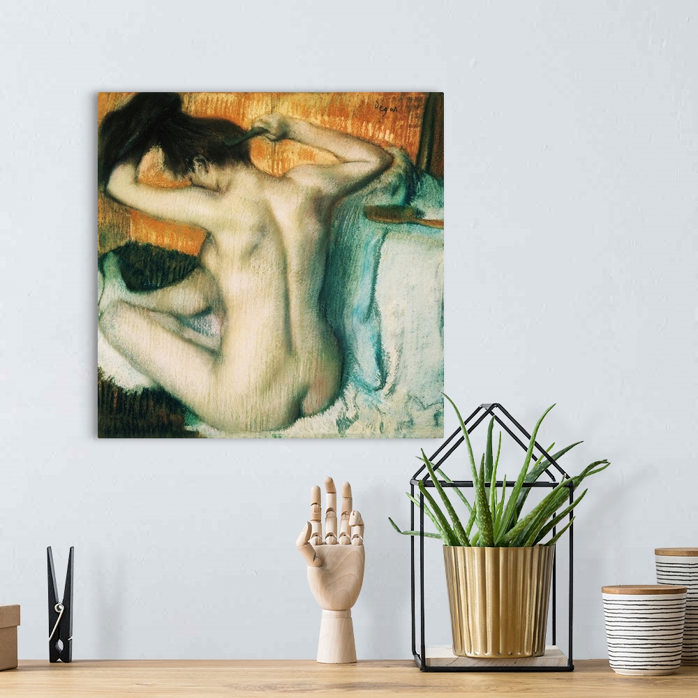 A bohemian room featuring A painting from early 20th century shows nude female figure combing her hair.
