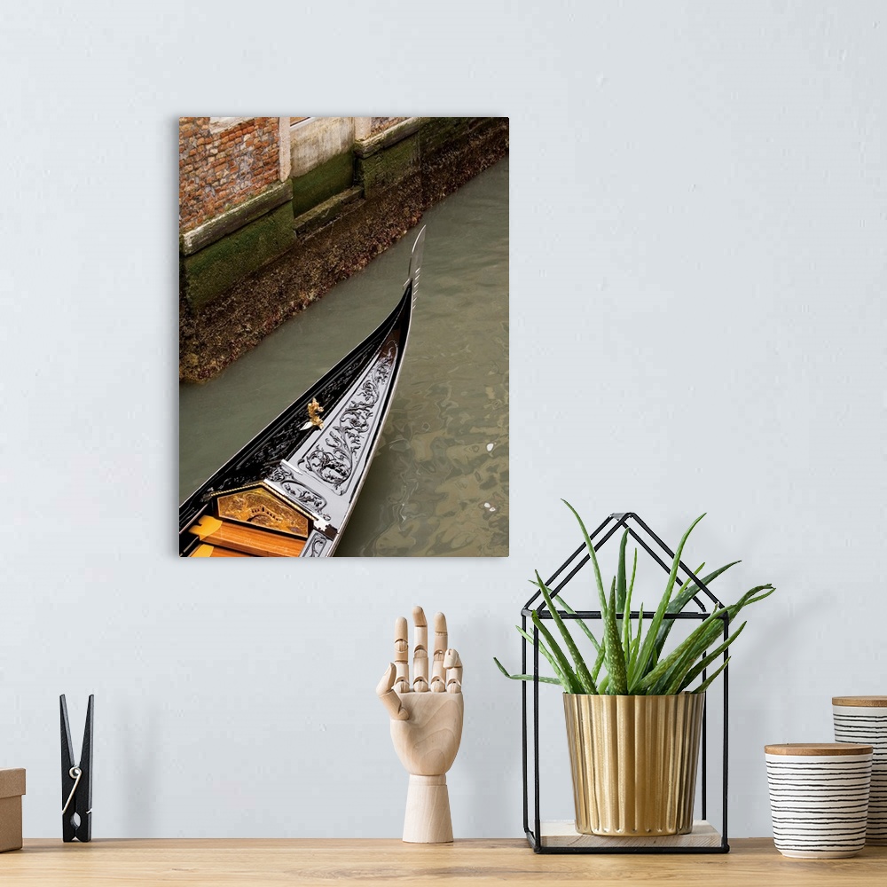 A bohemian room featuring Vertical photograph of a gondola boat ride in Venice.